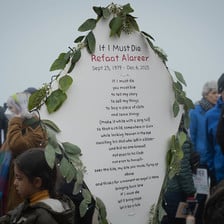 A placard containing the words of the poem If I Must Die 