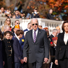 Joe Biden and Kamala Harris walk past a crowd