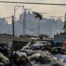 Military vehicles beside buildings in southern Gaza