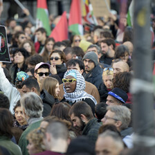 Crowds demonstrate with the Palestinian flag