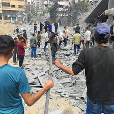 A number of people in the rubble of an area that Israel has attacked in Gaza City 