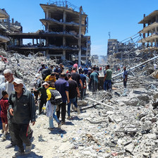 People walk amid rubble in northern Gaza 