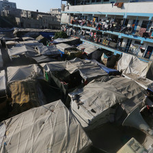 Rows of makeshift tents beside a school in Gaza 