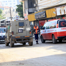 An Israeli military vehicle beside two ambulances in the occupied West Bank 