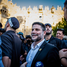 A man smiles gormlessly outside Jerusalem's Old City