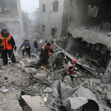 Emergency workers search rubble for survivors