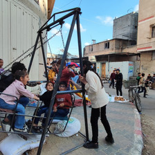 Children play on a swing