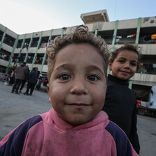Two children in a Gaza school that has become a shelter for displaced people 