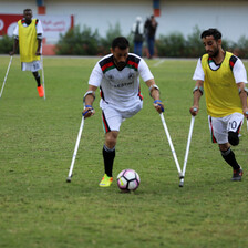 Footballers on crutches at play