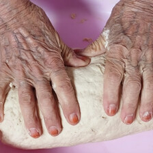 hands kneading dough