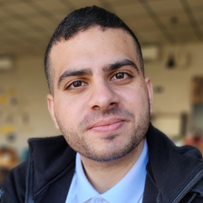 A man smiles at the camera
