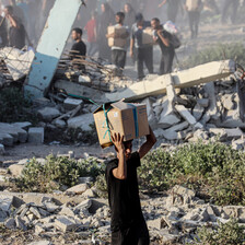 A man carries a box on his head