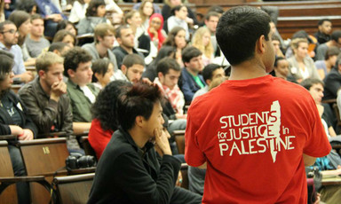 US students watch at a conference on Palestine