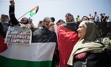 Women chant and carry banners