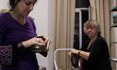 Women handle reels of film