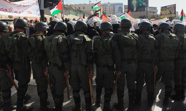 View of the backs of riot police at a demonstration