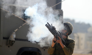 Israeli soldier fires tear gas rifle