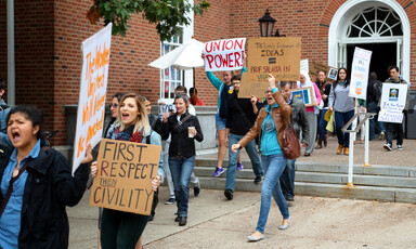 Young people carry signs in support of free speech, academic freedom and reinstatement of Steven Salaita