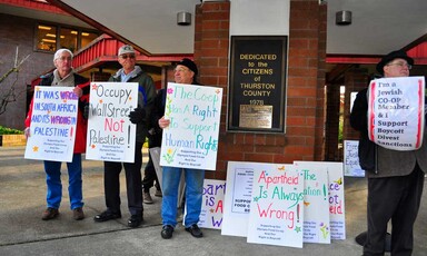 People holding signs