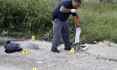 A man puts ax in plastic evidence bag