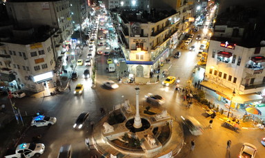 Nighttime aerial view of roundabout at Ramallah's city center