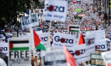 View of hundreds of signs and banners with Gaza and Palestine solidarity messages during massive London protest