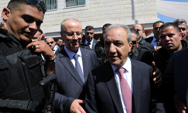 Bodyguards surround Rami Hamdallah and Majid Faraj