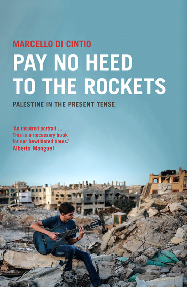 Cover of Pay No Heed to the Rockets book shows boy playing guitar while sitting on rubble of bombed-out building