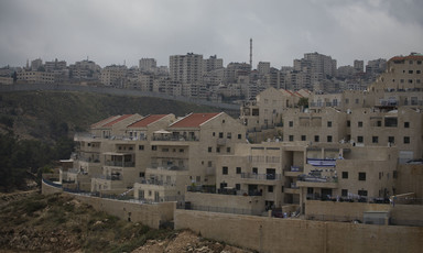The Israeli settlement of Pisgat Zeev (foreground), and the Palestinian Shuafat refugee camp behind the Israeli separation wall in occupied East Jerusalem. 