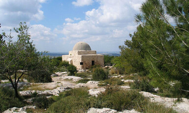 A lone Palestinian house stands amidst the ruins of villages demolished by Israel to make Canada Park.