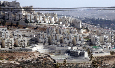 Numerous apartment buildings cover a hillside