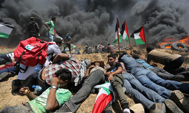 People take cover from a huge black plume of smoke 
