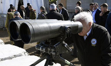Man uses enormous binoculars