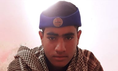 Teenage boy wearing knit cap