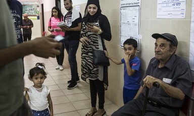 Group of people waiting in a hallway