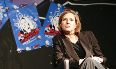 A woman sits in a chair