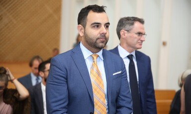 Man wearing suit and tie in court