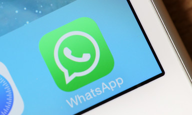 A closeup of the WhatsApp icon on a smartphone