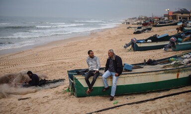 Two men sit on boat 