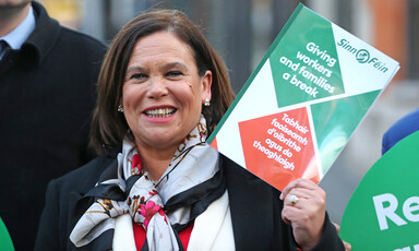 Woman holds up document