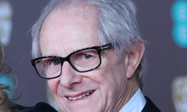 A man with glasses and a tuxedo