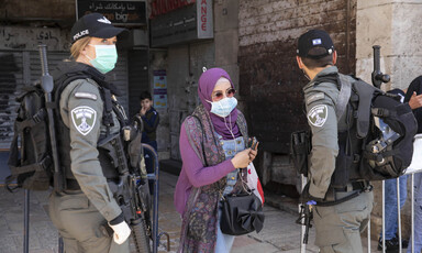 Woman standing between two soldiers 