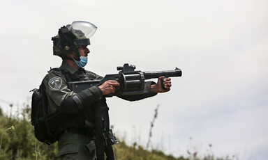 Soldier holds crowd-control weapon