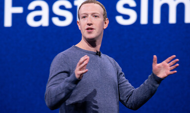 Man stands in front of screen