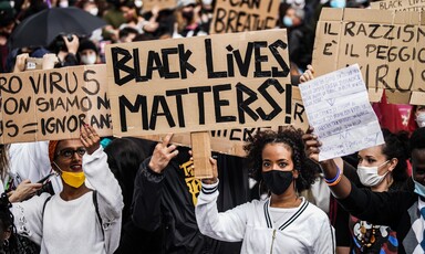 People hold signs