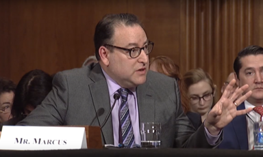 A man speaks into a microphone