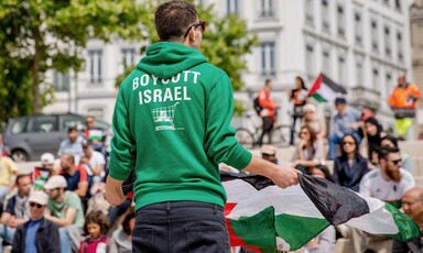 Man addresses crowd of demonstrators