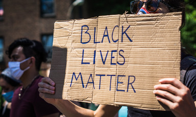 Protester holds sign reading Black Lives matter
