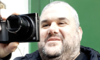 A man holds a camera