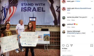 People hold signs with slogans supporting Israeli army